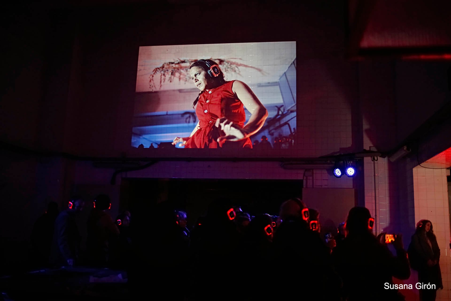 Live projection of the dancer on the tiled wall, with the audience listening through headphones